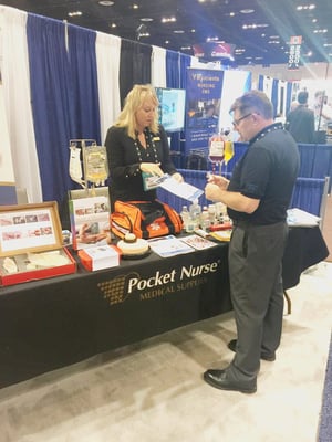 Author at a tradeshow for military